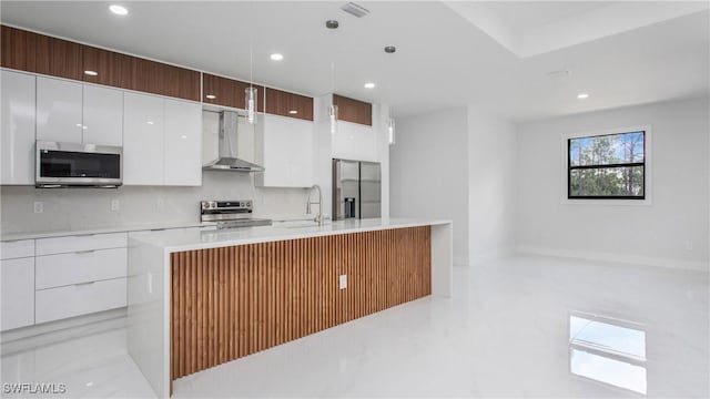 1420 Poinsettia Ave, Lehigh Acres, FL 33972 - kitchen with wall chimney range hood, white cabinets, stainless steel appliances, and a sink