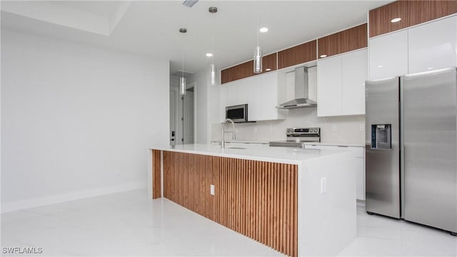 1420 Poinsettia Ave, Lehigh Acres, FL 33972 - kitchen with white cabinets, a sink, light countertops, wall chimney exhaust hood, and stainless steel appliances