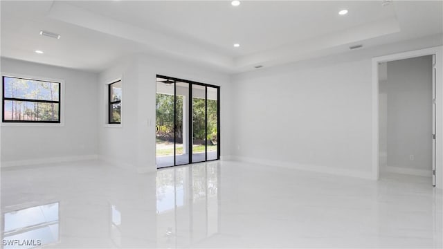 1420 Poinsettia Ave, Lehigh Acres, FL 33972 - tiled spare room with a raised ceiling, baseboards, and recessed lighting