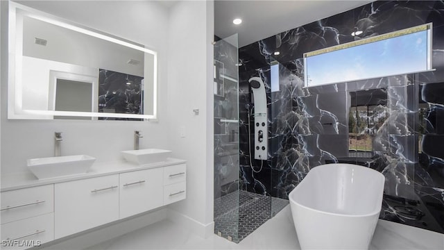 1420 Poinsettia Ave, Lehigh Acres, FL 33972 - bathroom with a sink, a marble finish shower, double vanity, and a freestanding tub