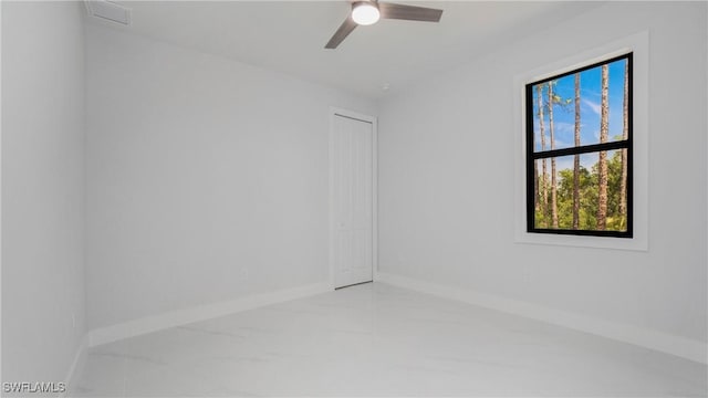 1420 Poinsettia Ave, Lehigh Acres, FL 33972 - unfurnished room featuring ceiling fan and baseboards