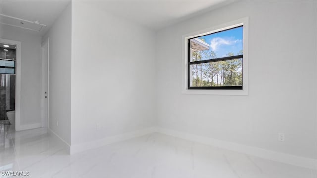 1420 Poinsettia Ave, Lehigh Acres, FL 33972 - spare room featuring baseboards and marble finish floor