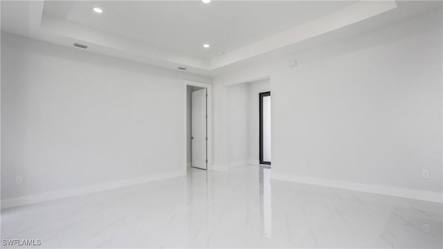 1420 Poinsettia Ave, Lehigh Acres, FL 33972 - unfurnished room featuring a raised ceiling, baseboards, and recessed lighting