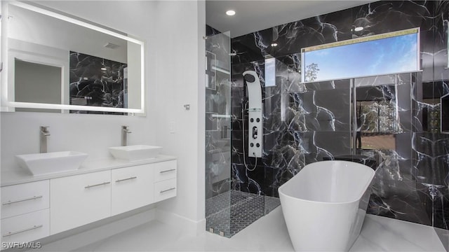 1420 Poinsettia Ave, Lehigh Acres, FL 33972 - bathroom featuring double vanity, a soaking tub, a marble finish shower, and a sink