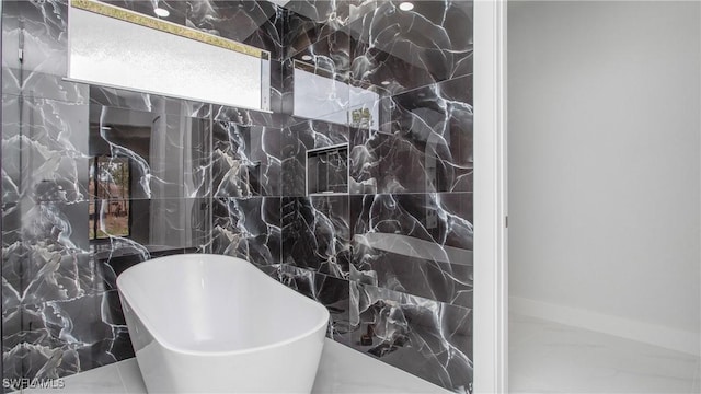 1420 Poinsettia Ave, Lehigh Acres, FL 33972 - full bathroom featuring a freestanding tub and tile walls