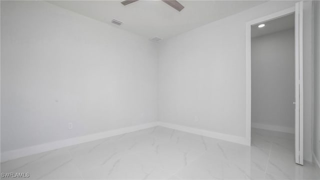 1420 Poinsettia Ave, Lehigh Acres, FL 33972 - empty room featuring baseboards, marble finish floor, ceiling fan, and visible vents