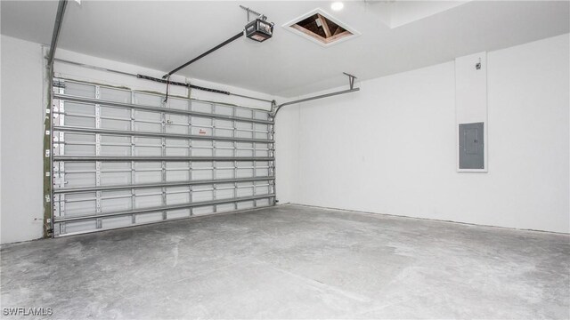 1420 Poinsettia Ave, Lehigh Acres, FL 33972 - garage featuring a garage door opener and electric panel