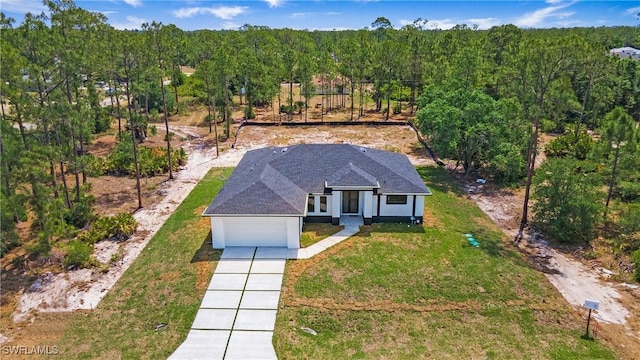 1420 Poinsettia Ave, Lehigh Acres, FL 33972 - aerial view with a wooded view