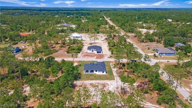 1420 Poinsettia Ave, Lehigh Acres, FL 33972 - drone / aerial view with a view of trees