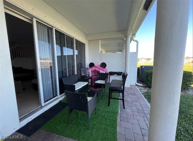 view of patio featuring central AC unit