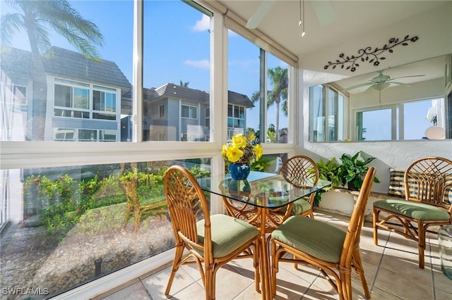 sunroom / solarium with a healthy amount of sunlight and ceiling fan