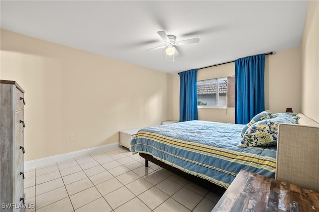 tiled bedroom with ceiling fan