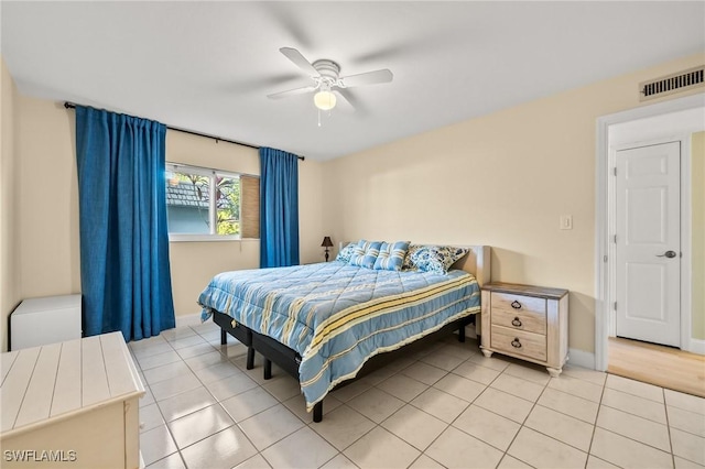 bedroom featuring ceiling fan and light tile patterned flooring