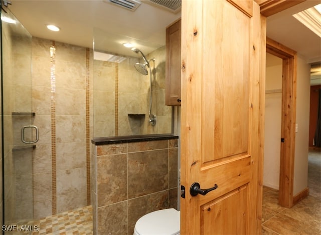 full bathroom with toilet, a stall shower, visible vents, and tile patterned floors