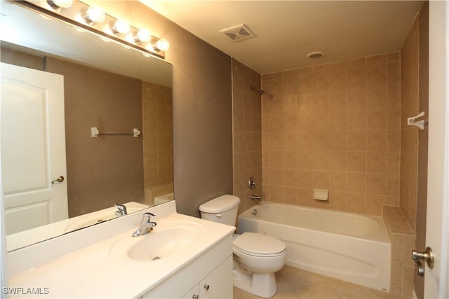 full bathroom featuring visible vents, toilet, tile patterned floors, vanity, and shower / washtub combination