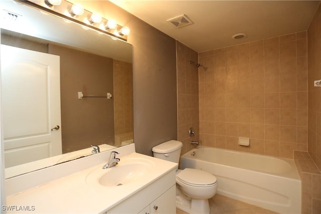 bathroom with toilet, tile patterned floors, visible vents, and vanity