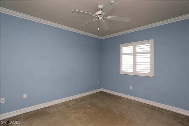 carpeted empty room featuring ornamental molding, baseboards, and a ceiling fan