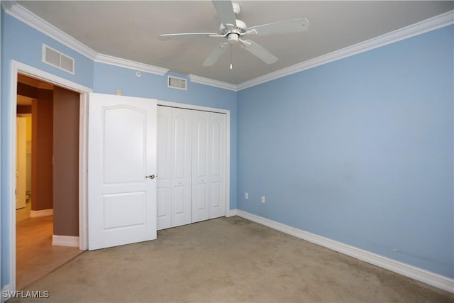 unfurnished bedroom featuring light carpet, visible vents, and ornamental molding