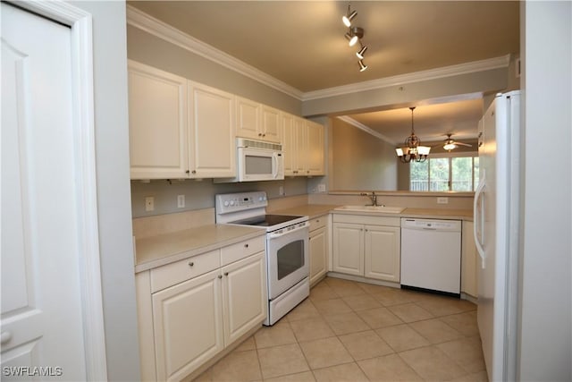 kitchen featuring white appliances, white cabinets, hanging light fixtures, light countertops, and crown molding