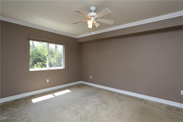 spare room featuring light carpet, baseboards, and ornamental molding