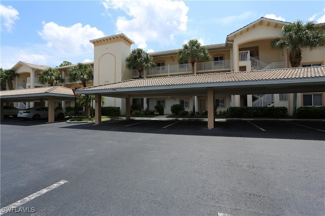 view of property featuring covered parking