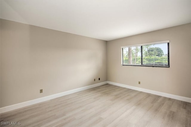 spare room with light hardwood / wood-style floors