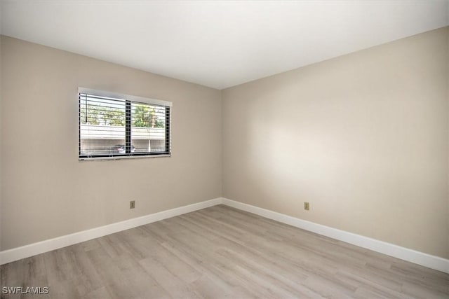 unfurnished room with light hardwood / wood-style floors