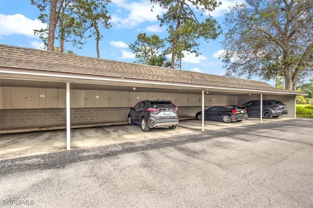 view of vehicle parking featuring a carport