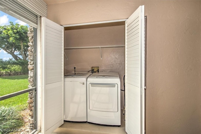 laundry room with washing machine and clothes dryer