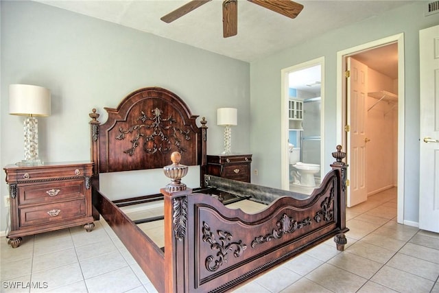 1100 Pondella Rd Unit 807, Cape Coral, FL 33909 - bedroom featuring light tile patterned floors, ensuite bath, a ceiling fan, and baseboards