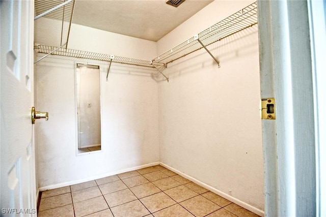 1100 Pondella Rd Unit 807, Cape Coral, FL 33909 - walk in closet with light tile patterned floors