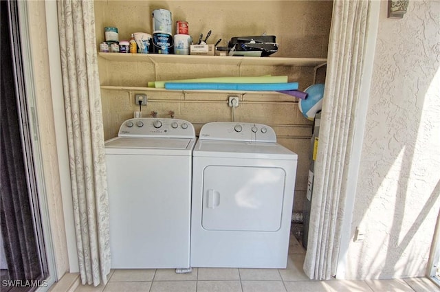 1100 Pondella Rd Unit 807, Cape Coral, FL 33909 - laundry area featuring washing machine and clothes dryer and light tile patterned floors