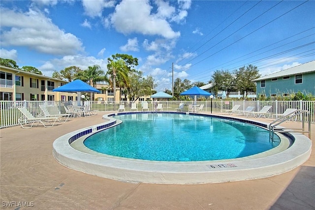 1100 Pondella Rd Unit 807, Cape Coral, FL 33909 - community pool featuring a patio