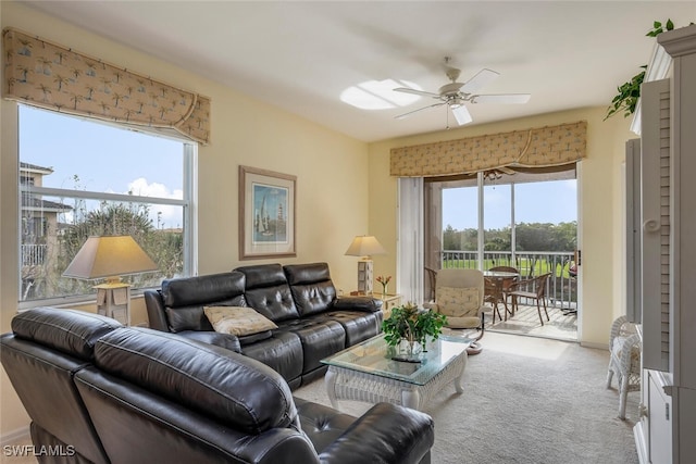 living room with light colored carpet and ceiling fan