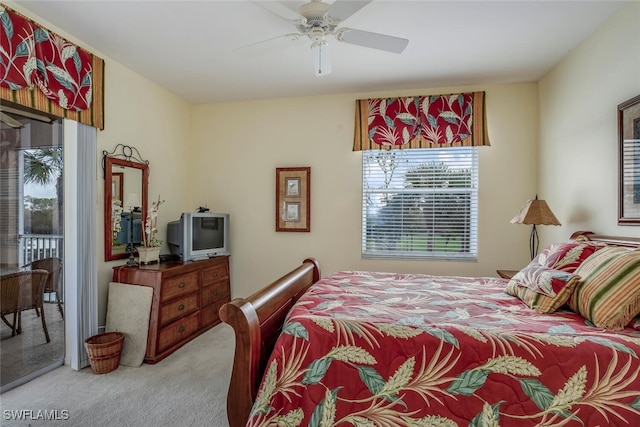 carpeted bedroom with ceiling fan and access to exterior