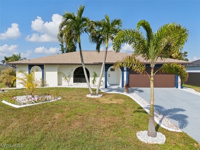 ranch-style house featuring a garage and a front lawn