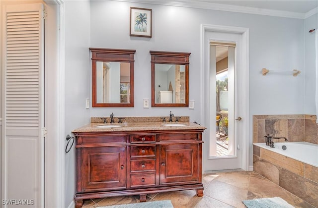 full bathroom featuring a closet, plenty of natural light, a sink, and crown molding