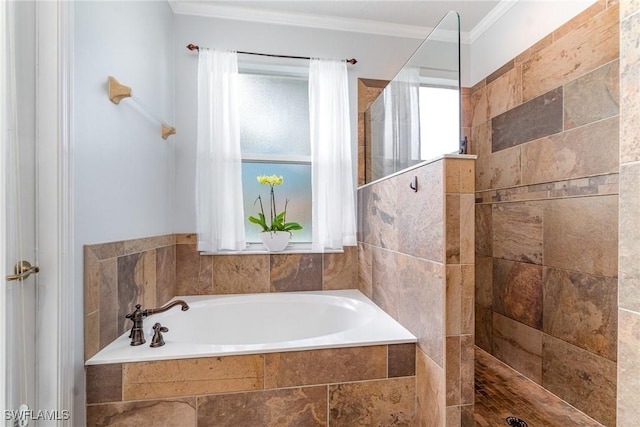 bathroom with walk in shower, a bath, and crown molding