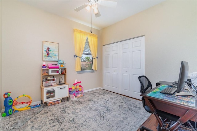 office with a ceiling fan and baseboards