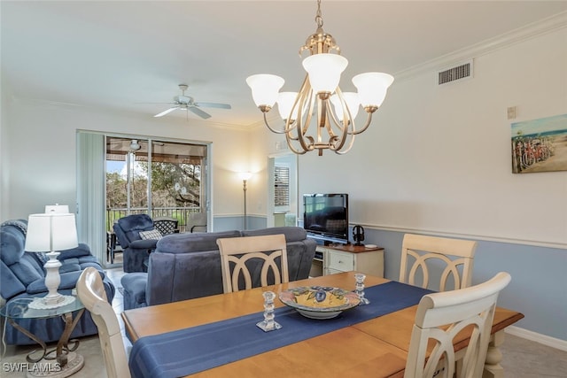 dining space with crown molding and ceiling fan with notable chandelier