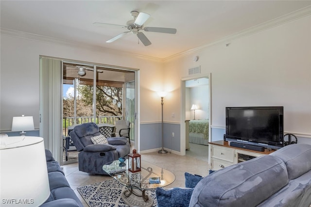 tiled living room with ornamental molding and ceiling fan