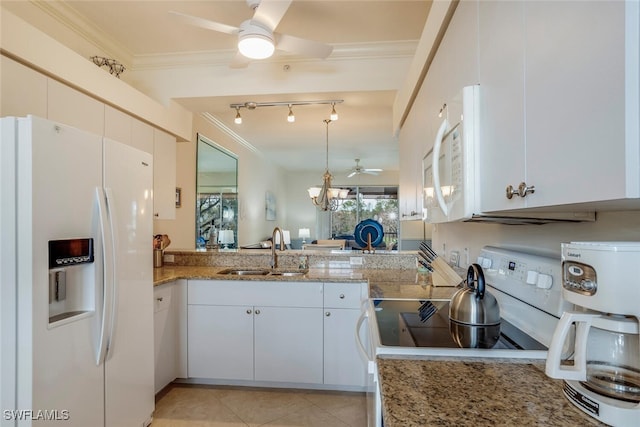 kitchen with crown molding, white appliances, sink, and white cabinets