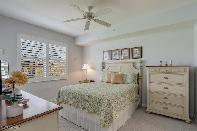 carpeted bedroom with multiple windows and ceiling fan