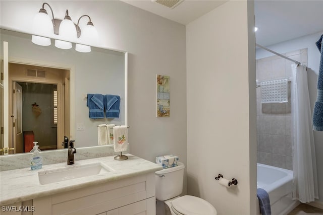 full bathroom featuring vanity, toilet, and shower / bath combo with shower curtain