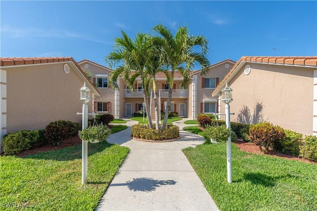 725 Saratoga Cir Unit A103, Naples, FL 34104 - surrounding community featuring a yard