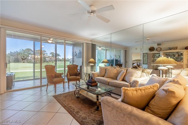 725 Saratoga Cir Unit A103, Naples, FL 34104 - living area with visible vents, ceiling fan, and light tile patterned flooring