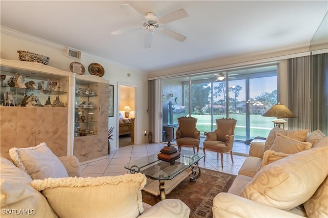 725 Saratoga Cir Unit A103, Naples, FL 34104 - living area with visible vents, ceiling fan, and crown molding