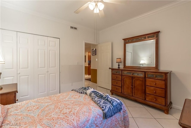 725 Saratoga Cir Unit A103, Naples, FL 34104 - bedroom featuring light tile patterned floors, a closet, ornamental molding, visible vents, and a ceiling fan