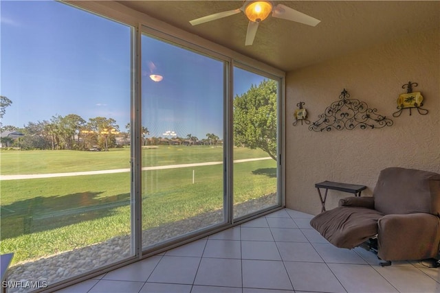 725 Saratoga Cir Unit A103, Naples, FL 34104 - sunroom / solarium featuring a ceiling fan