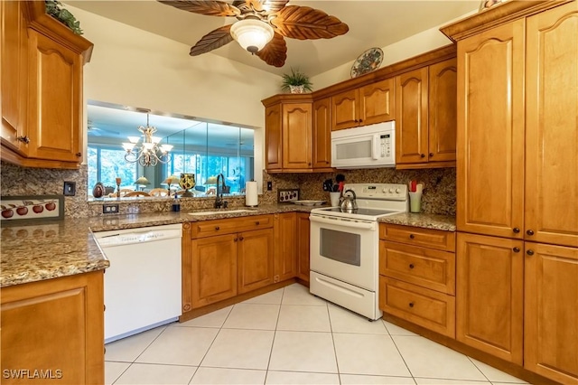 725 Saratoga Cir Unit A103, Naples, FL 34104 - kitchen with decorative backsplash, a sink, brown cabinetry, and white appliances